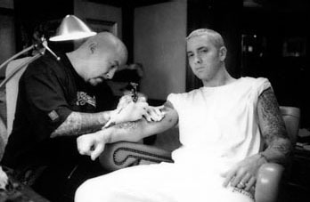 Eminem getting tattooed by Mister Cartoon